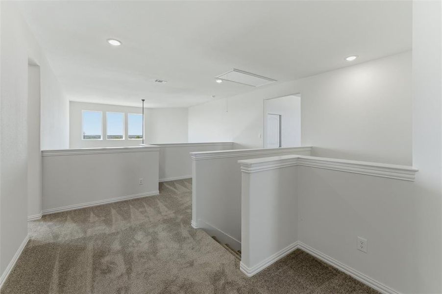 Hall featuring carpet, an upstairs landing, and recessed lighting Hall featuring carpet, an upstairs landing, and recessed lighting