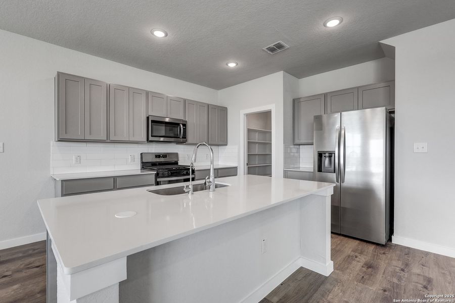 Furnished interior view inside a new home in Hacienda, San Antonio (Image 7).