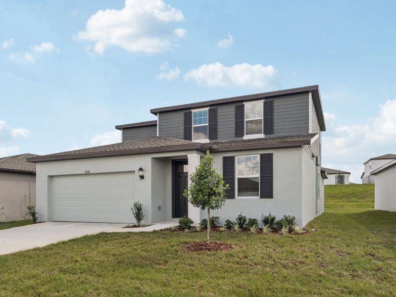 Front exterior of a new home in Benton Hills - Classic Series, Brooksville, FL, highlighting curb appeal (Image 2).
