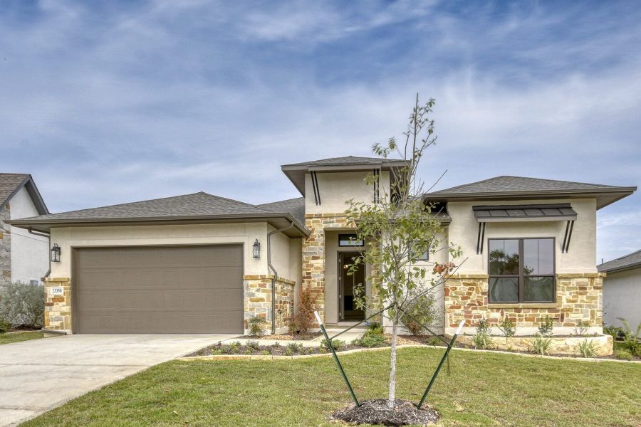 Front exterior of a new home in El Sonido at Campanas, San Antonio, TX, highlighting curb appeal (Image 2).