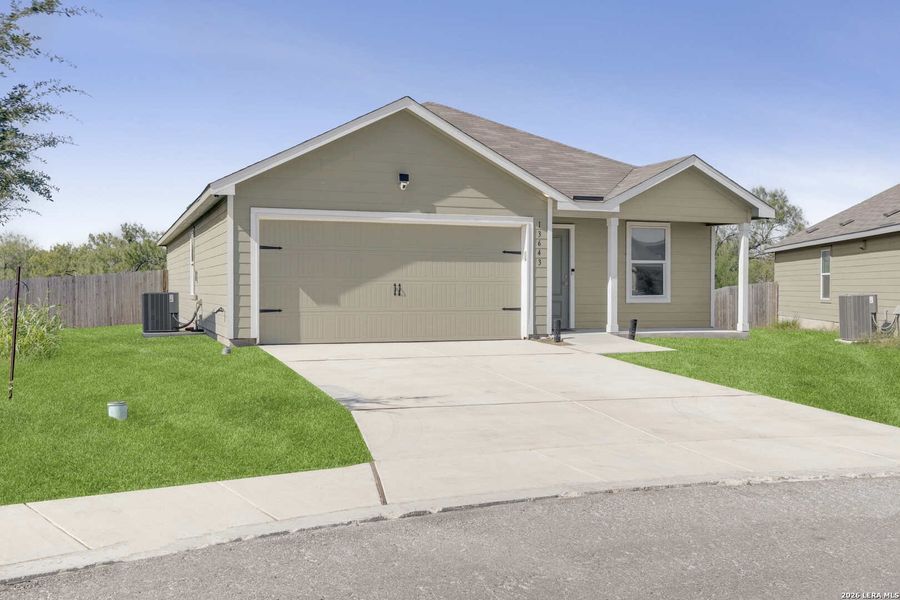 Front exterior of a new home in Mission del Lago, San Antonio, TX, highlighting curb appeal (Image 24).