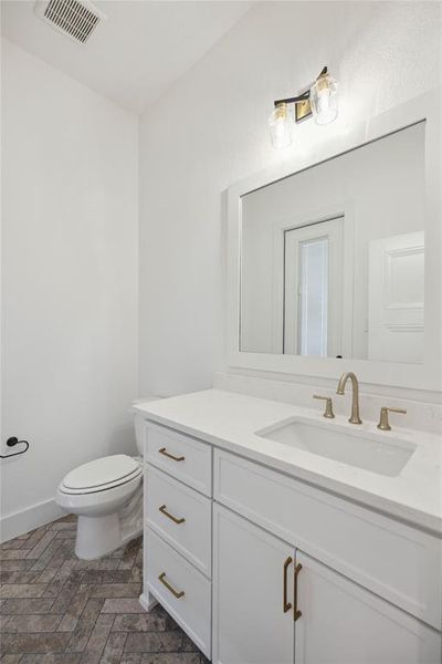 Bathroom featuring toilet and vanity