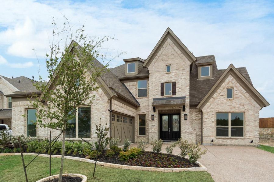Representative exterior photo of a completed home built from the Grand Whitehall by Grand Homes in Monterra, Fate, TX (Image 20). Representative exterior photo of a completed home built from the Grand Whitehall by Grand Homes in Monterra, Fate, TX (Image 20).