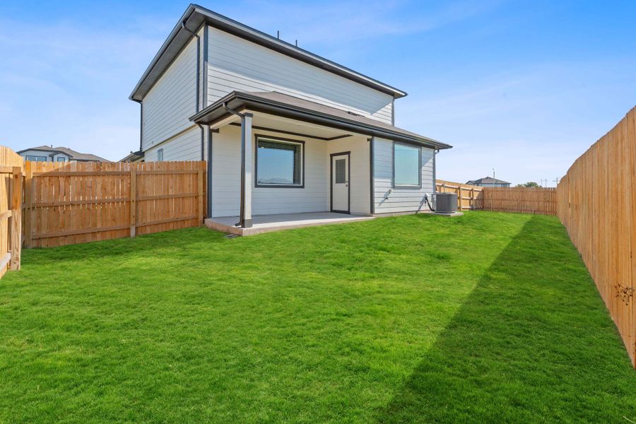 Rear view of property featuring a patio and a fenced backyard Rear view of property featuring a patio and a fenced backyard