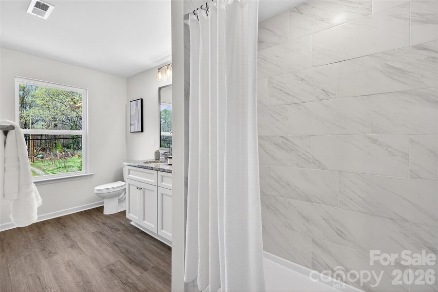 Furnished interior view inside a new home in , Charlotte (Image 9).