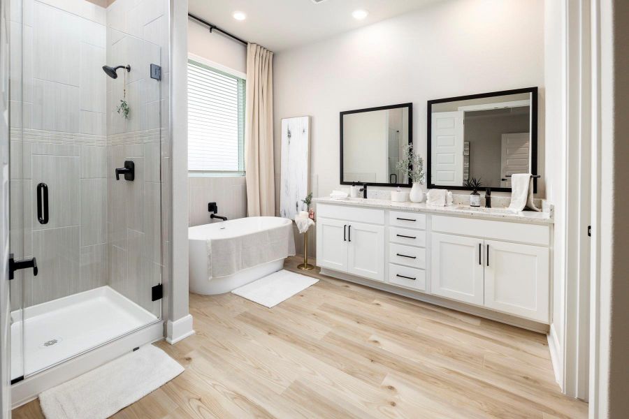 Double sinks and beautiful countertops add to the tranquility of this spa like bathroom.