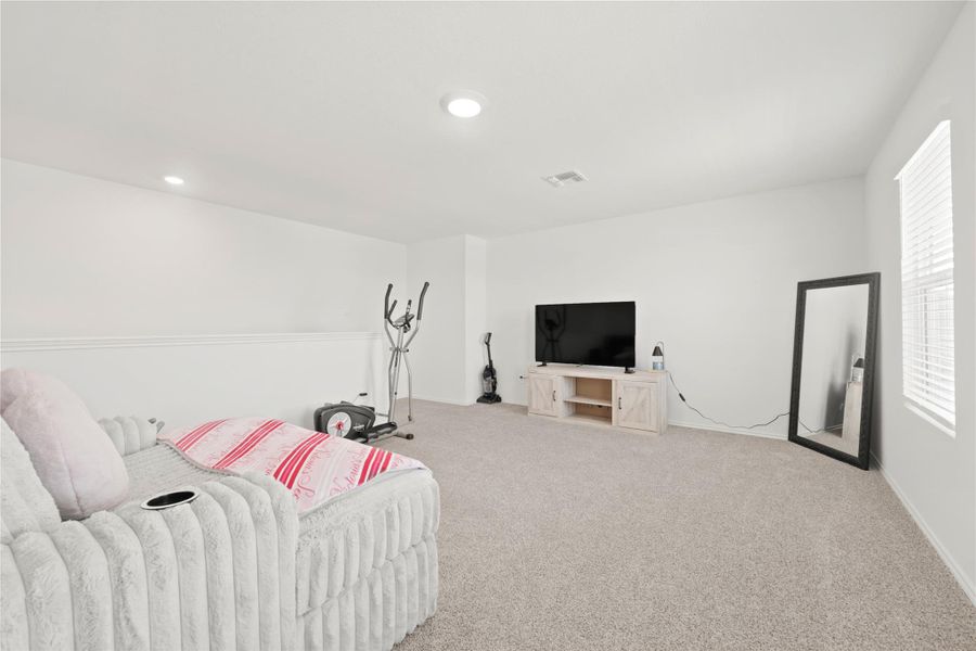 Double the living potential! This expansive upstairs retreat offers a versatile second lounge area, perfect for movie nights, a gaming hub, or just extra room for the whole family to spread out.