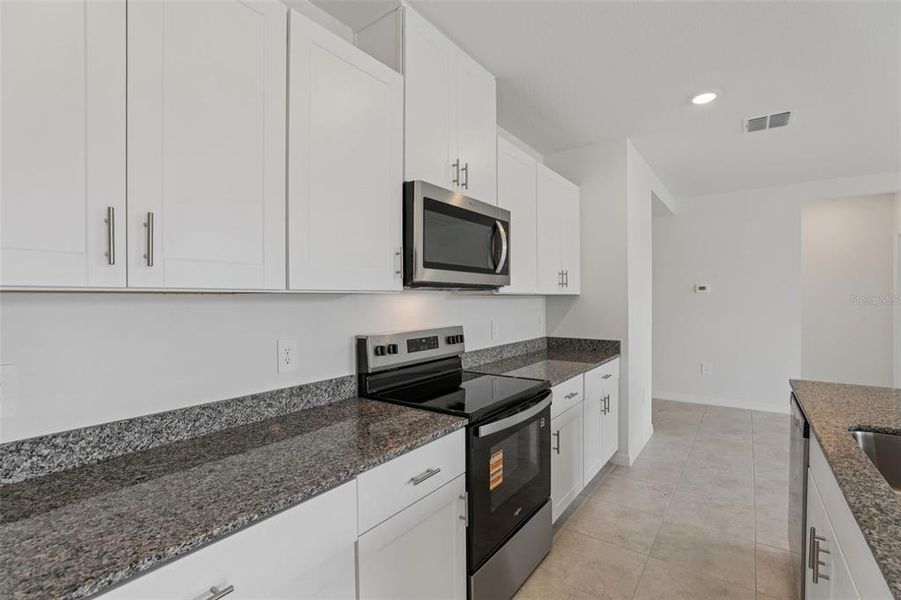 Furnished interior view inside a new home in Lawson Dunes - Signature Series, Haines City (Image 11). Furnished interior view inside a new home in Lawson Dunes - Signature Series, Haines City (Image 11).