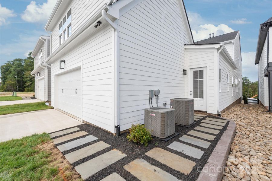 Front exterior of a new home in , Davidson, NC, highlighting curb appeal (Image 25).