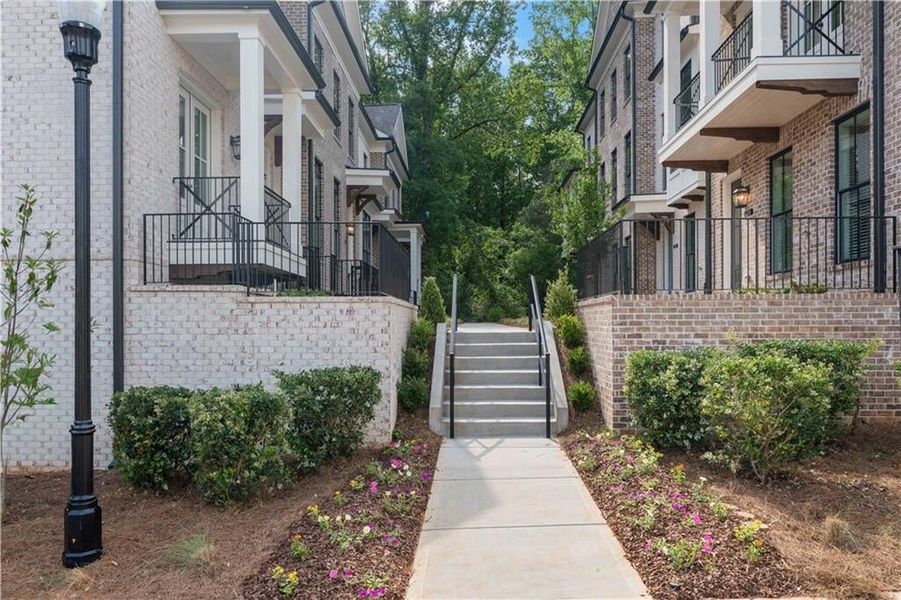 Landscaped front entry to your cute and cozy courtyard style entrance