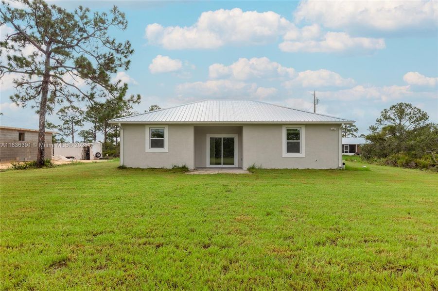 Front exterior of a new home in , Lake Placid, FL, highlighting curb appeal (Image 23).