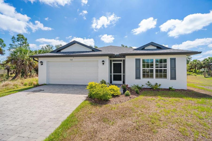 Front exterior of a new home in , Port Charlotte, FL, highlighting curb appeal (Image 24).