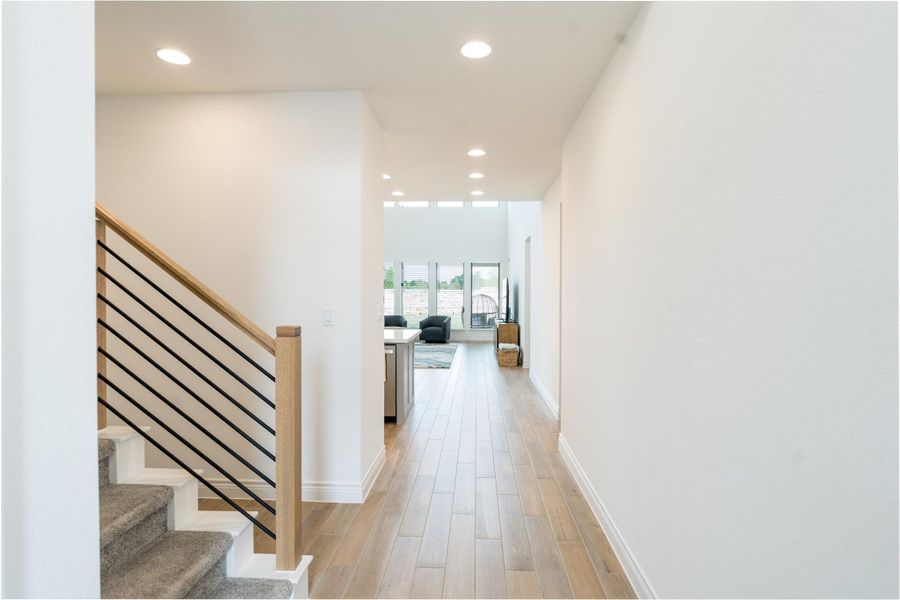 Hall featuring recessed lighting and light wood-style floors