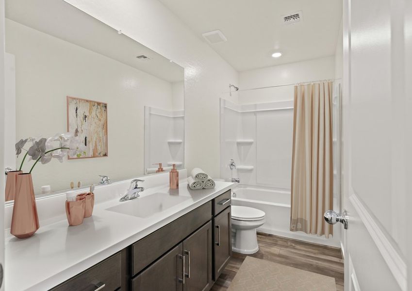 Guests have ample space for getting ready in the spacious guest bathroom. Guests have ample space for getting ready in the spacious guest bathroom.