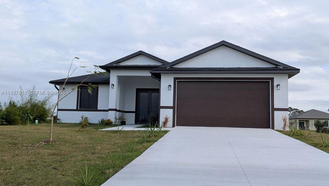 Front exterior of a new home in , Labelle, FL, highlighting curb appeal (Image 23).