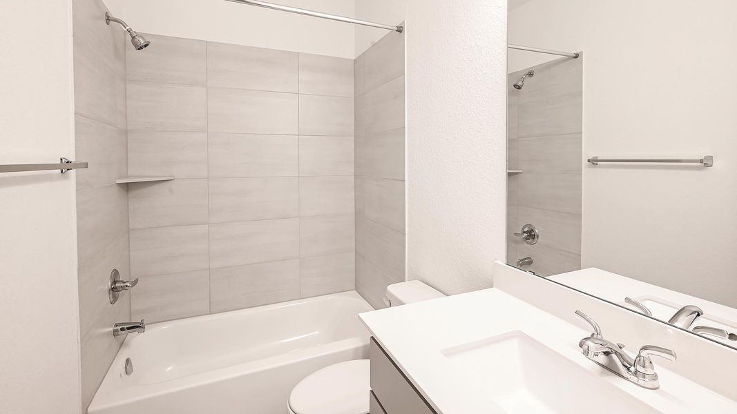 Bathroom featuring shower / bathtub combination and vanity Bathroom featuring shower / bathtub combination and vanity