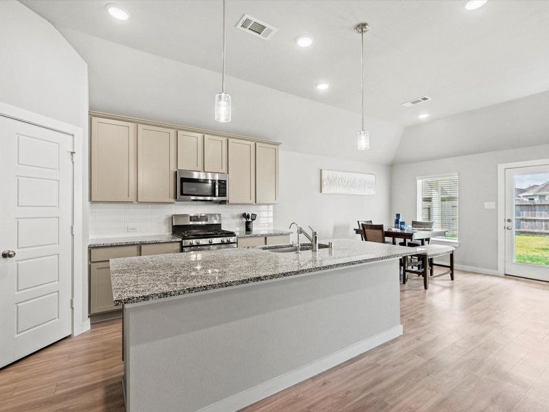 Kitchen view showing generous counter space and upgraded cabinetry.