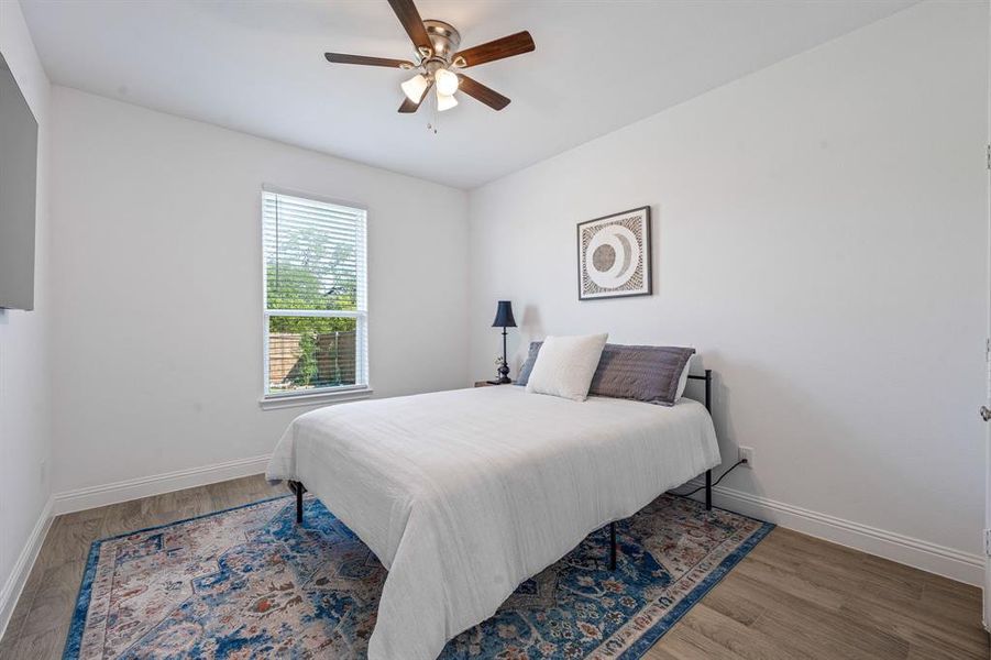 Bedroom featuring light wood-type flooring and a ceiling fan