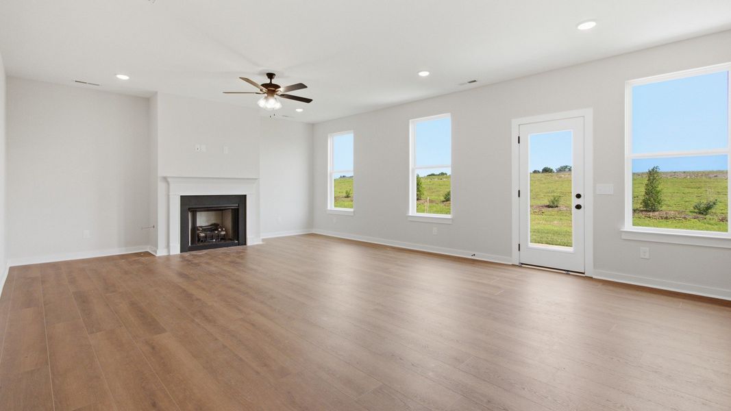 Cozy living room with lots of natural light and a gas fireplace