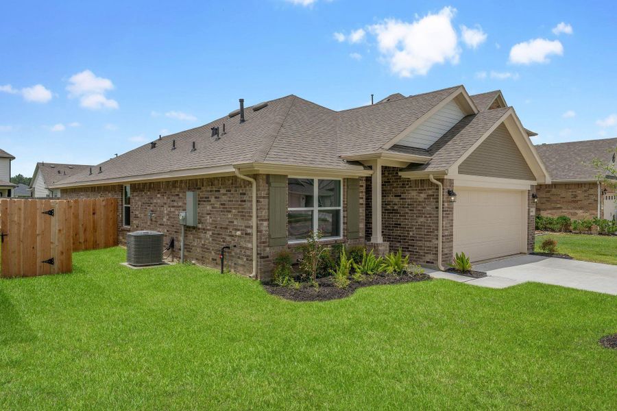 Front exterior of a new home in Grand Oaks Reserve, Cleveland, TX, highlighting curb appeal (Image 16). Front exterior of a new home in Grand Oaks Reserve, Cleveland, TX, highlighting curb appeal (Image 16).
