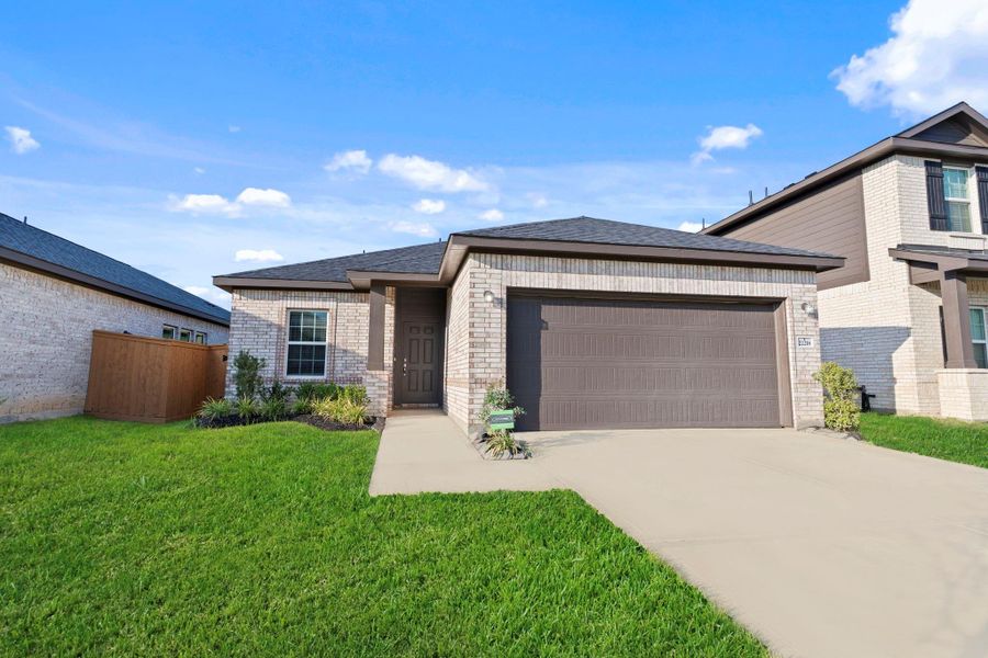 A closer look at the all-brick exterior showcases durable craftsmanship and inviting curb appeal. The wide driveway offers plenty of space for parking and leads to a spacious two-car garage.  New one-story ranch home by CastleRock Communities Homes! Energy Star Rated with Tankless/On-Demand H2O Heater!