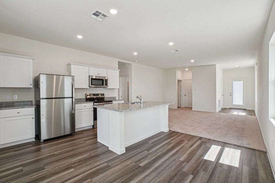 Representative furnished interior of a home built from the Odyssey by Starlight Homes in Williams Landing, Waller (Image 8).