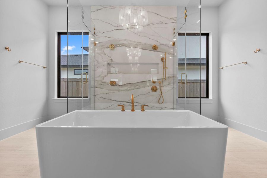 The enchanting spa-like main bath. Representative image.