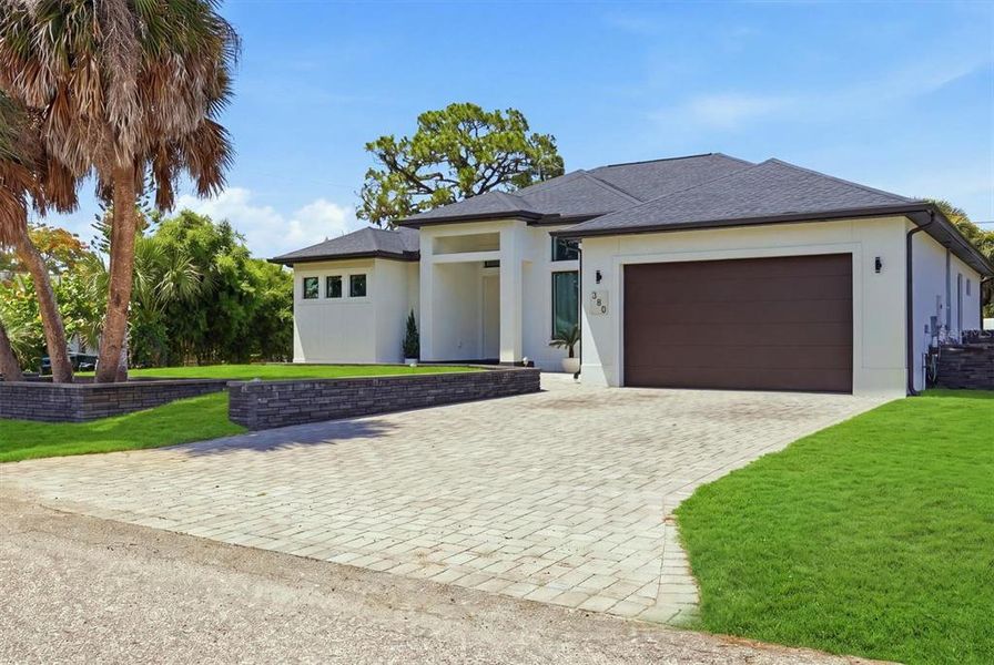 Front exterior of a new home in , Venice, FL, highlighting curb appeal (Image 2). Front exterior of a new home in , Venice, FL, highlighting curb appeal (Image 2).