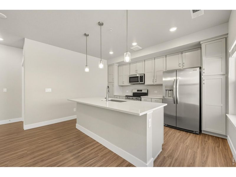 Furnished interior view inside a new home in The Lakes at Centerra - North Shore Flats, Loveland (Image 6).
