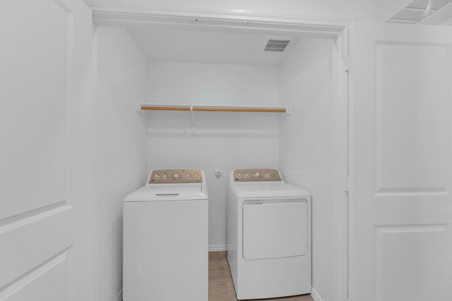 Laundry closet in the hallway.