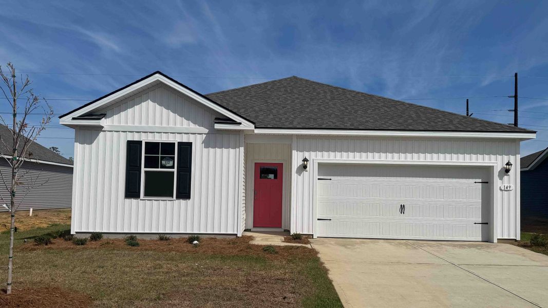 Front exterior of a new home in Winfield Farms, Myrtle Beach, SC, highlighting curb appeal (Image 1). Front exterior of a new home in Winfield Farms, Myrtle Beach, SC, highlighting curb appeal (Image 1).