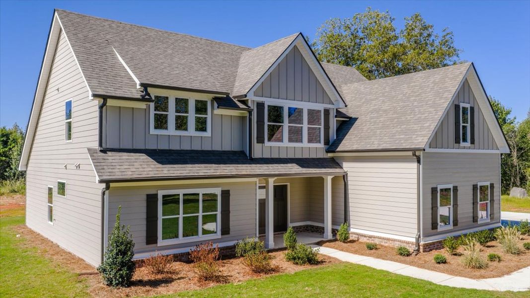 Front exterior of a new home in Collier Grove, Thomaston, GA, highlighting curb appeal (Image 23). Front exterior of a new home in Collier Grove, Thomaston, GA, highlighting curb appeal (Image 23).