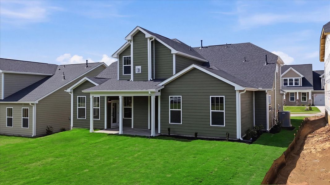 Highly functional rear covered porch adds memorable living space to this elegant home at the Benjamin's Grove community Highly functional rear covered porch adds memorable living space to this elegant home at the Benjamin's Grove community