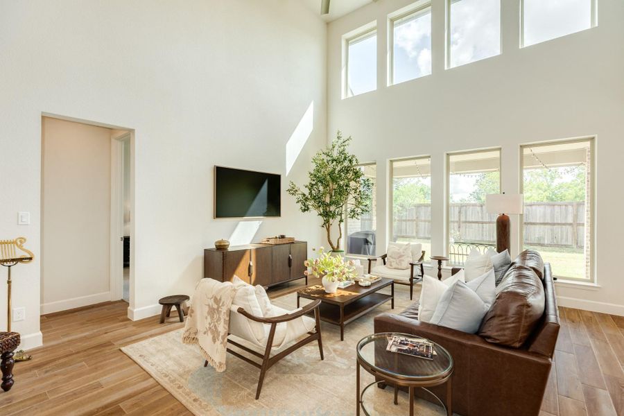 This view showcases the elegant entrance to the primary bedroom from the spacious family room, creating a seamless transition into a private retreat that is the perfect place to relax and unwind after a long day. This view showcases the elegant entrance to the primary bedroom from the spacious family room, creating a seamless transition into a private retreat that is the perfect place to relax and unwind after a long day.