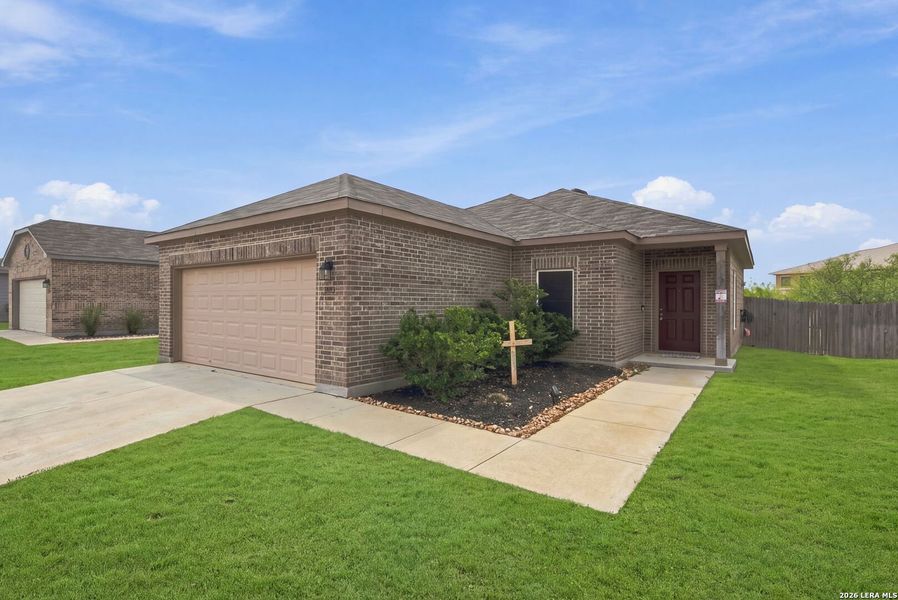 Front exterior of a new home in , Lytle, TX, highlighting curb appeal (Image 18).