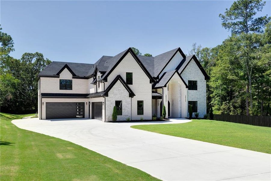 Front exterior of a new home in , Suwanee, GA, highlighting curb appeal (Image 2).
