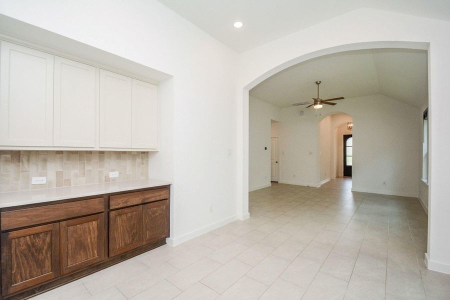 Spacious family room open to the kitchen and dining area. Spacious family room open to the kitchen and dining area.