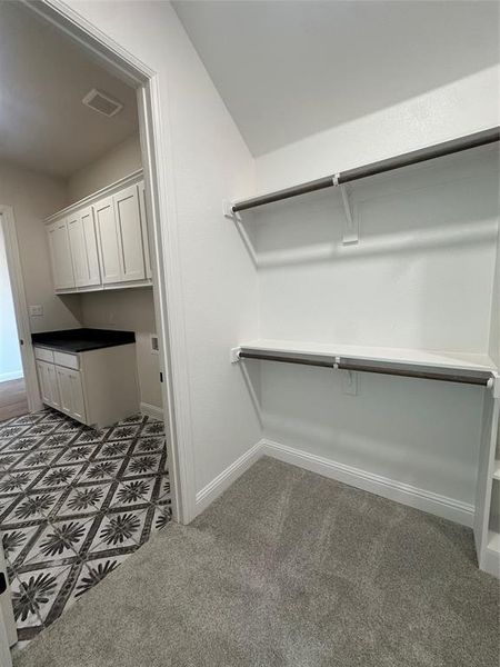 Primary Closet Adjoins Laundry Room Primary Closet Adjoins Laundry Room