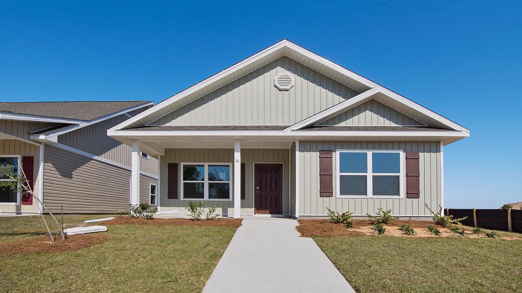 Representative exterior photo of a completed home built from the Porter by D.R. Horton in Owl's Head East, Freeport, FL (Image 1).