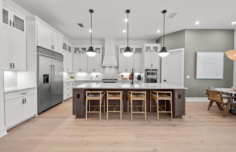 Representative furnished interior of a home built from the Layton Grande by DiVosta in BeachWalk by Manasota Key, Englewood (Image 30).