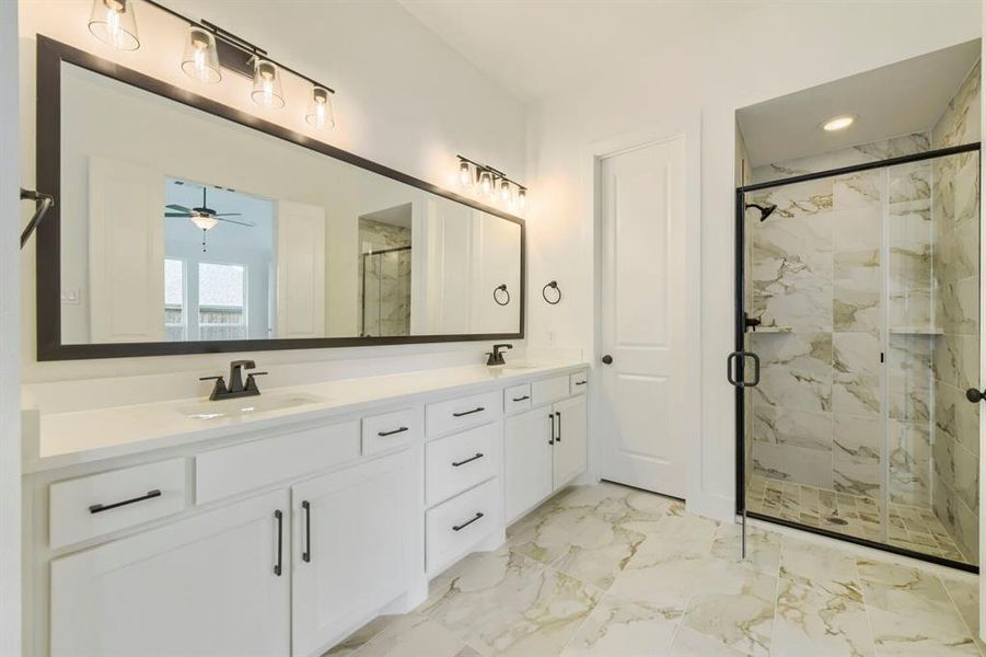 Dual vanity with white cabinetry and quartz countertops Dual vanity with white cabinetry and quartz countertops