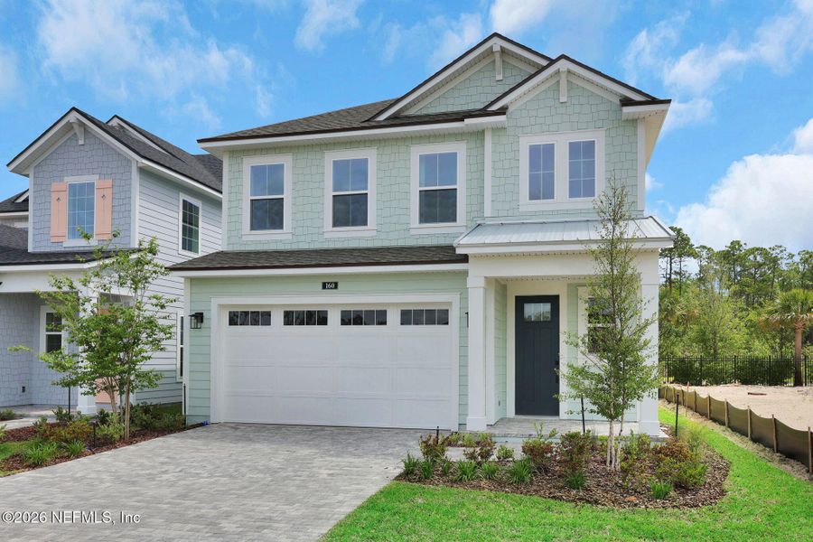 Front exterior of a new home in Seabrook Village at Seabrook, Nocatee, FL, highlighting curb appeal (Image 25).