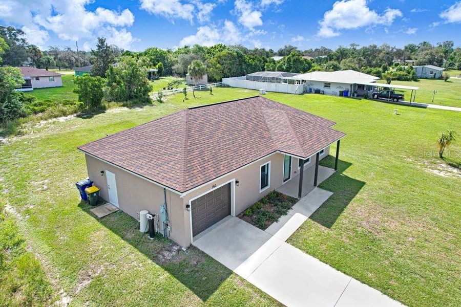Front exterior of a new home in , Lake Placid, FL, highlighting curb appeal (Image 19). Front exterior of a new home in , Lake Placid, FL, highlighting curb appeal (Image 19).