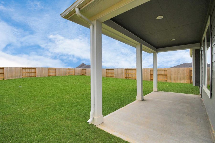 Exterior details and patio area of a home in Sunterra, Katy (Image 17).