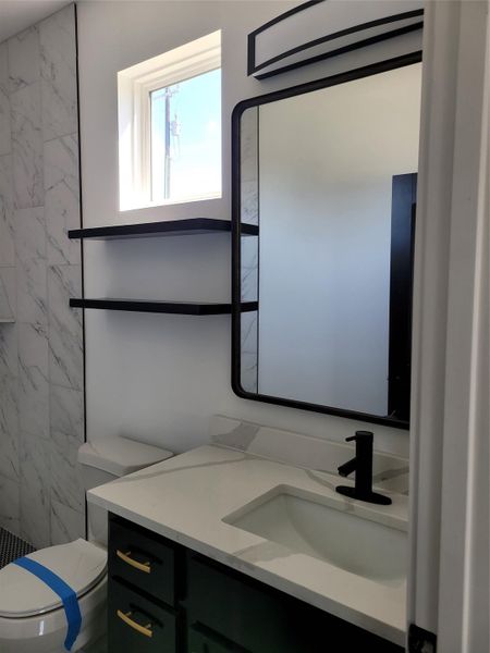 A well-appointed bathroom vanity features a sleek sink and stylish fixtures. A well-appointed bathroom vanity features a sleek sink and stylish fixtures.