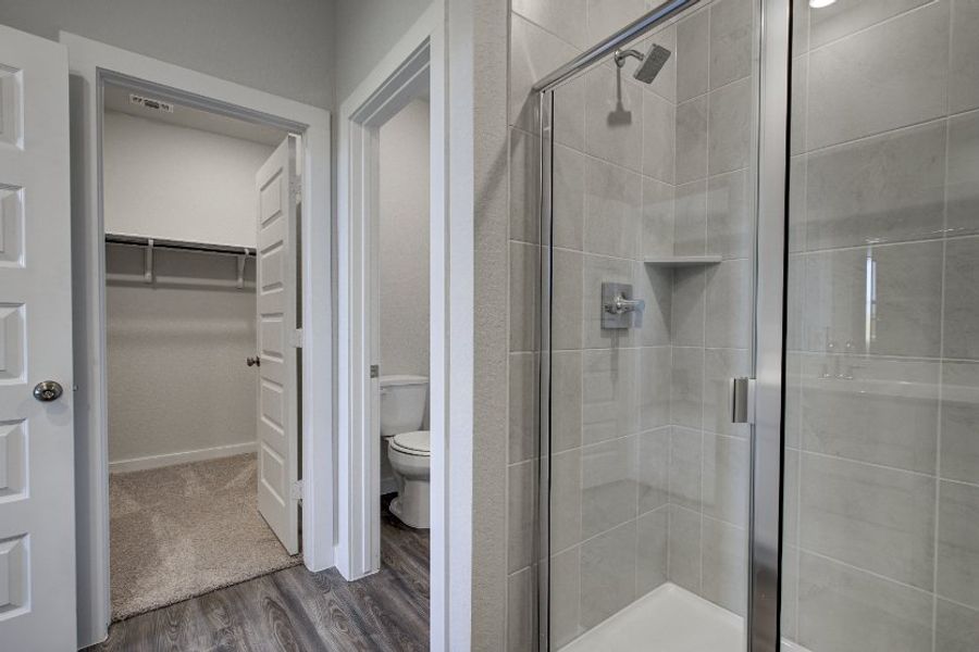 A bathroom with a glass shower.