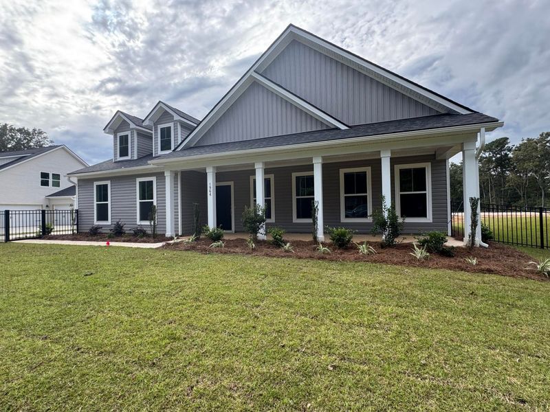 Front exterior of a new home in Central Estates, Summerville, SC, highlighting curb appeal (Image 1).