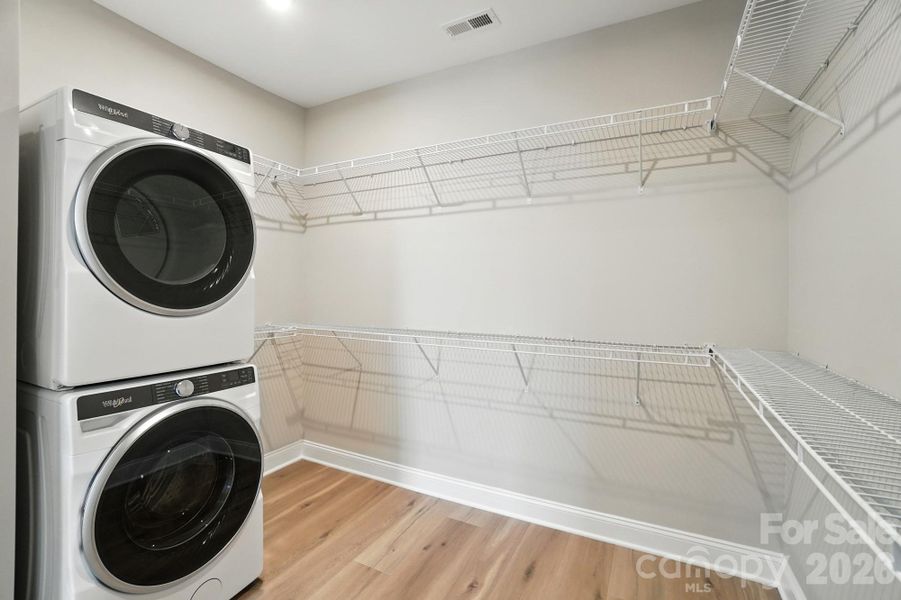 representation of primary closet with included washer/dryer
