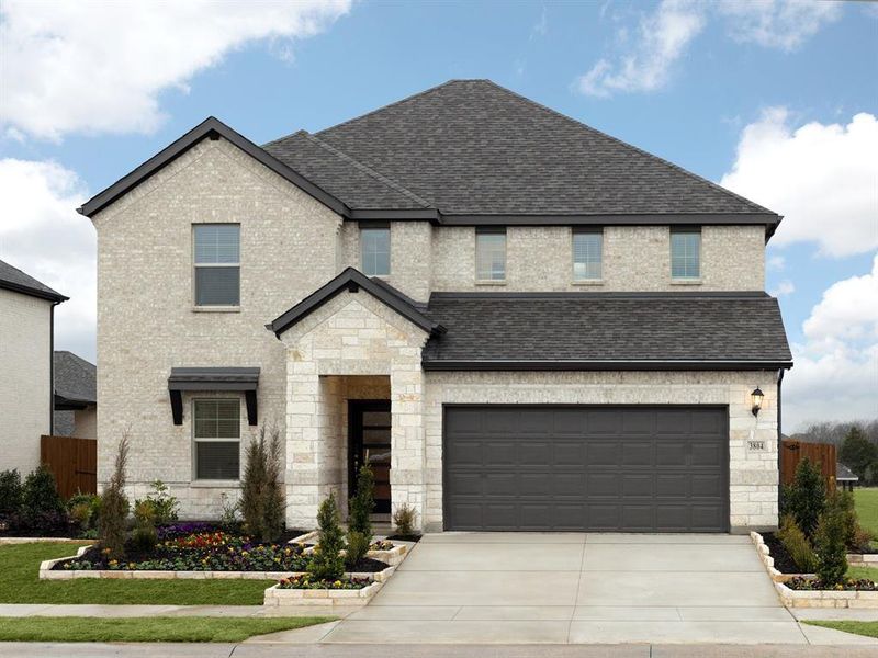 View of front of home featuring a garage