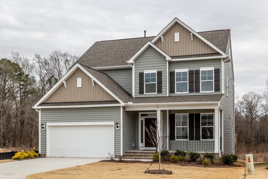 Front exterior of a new home in Ford Meadows, Garner, NC, highlighting curb appeal (Image 2). Front exterior of a new home in Ford Meadows, Garner, NC, highlighting curb appeal (Image 2).